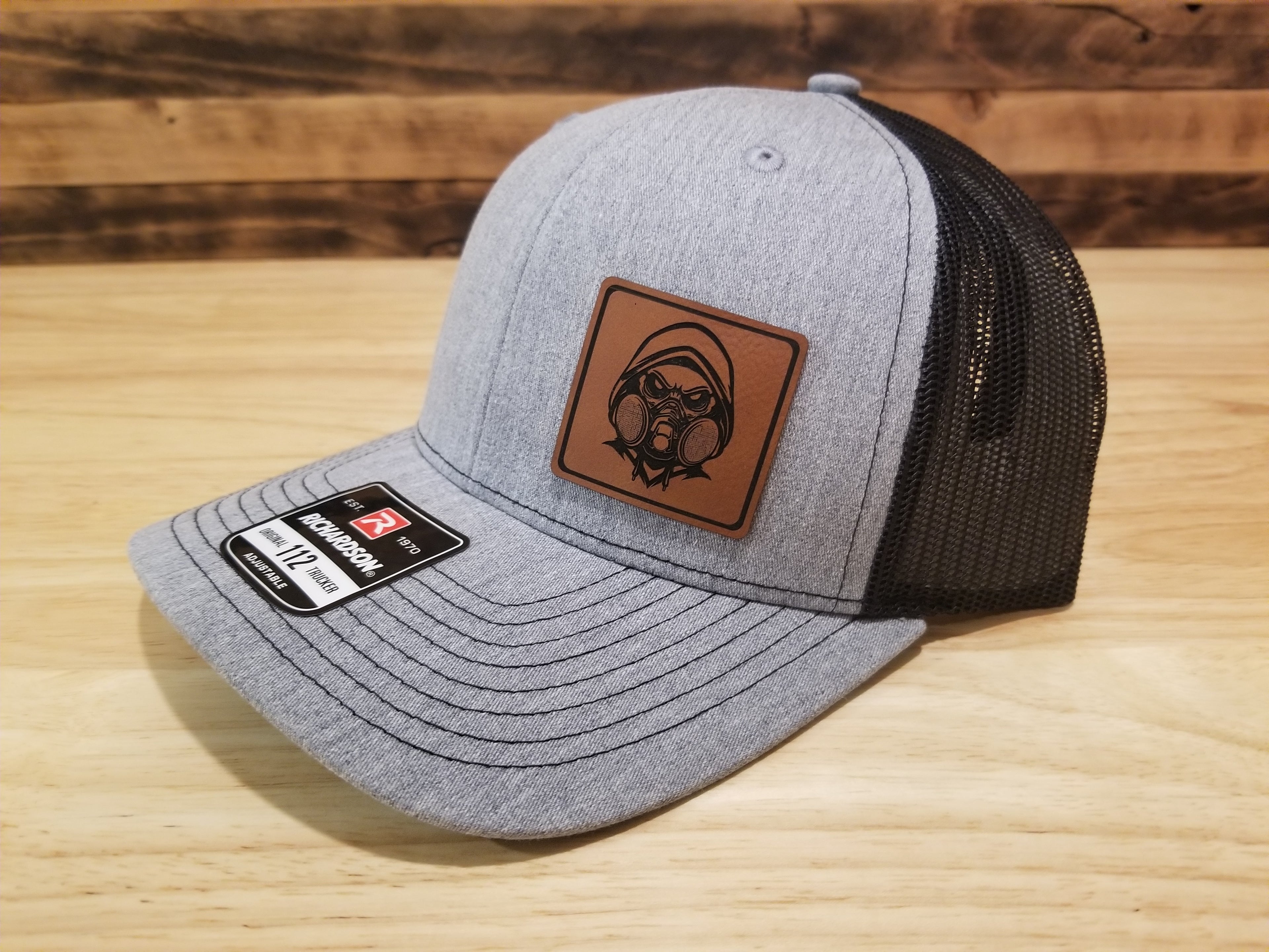 Body Shop Merch Hat with Rawhide Skull wearing dust mask and hoodie