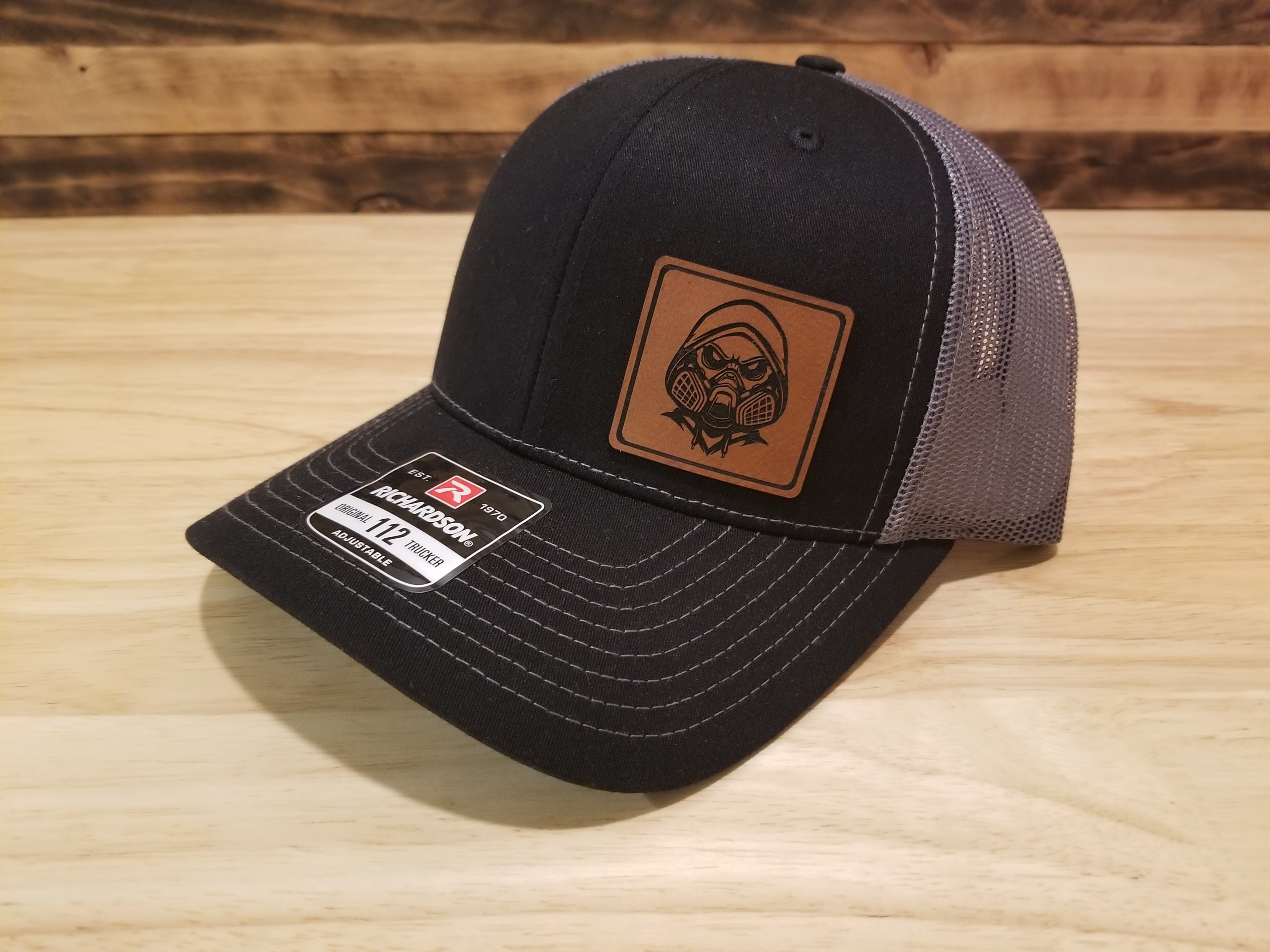 Body Shop Merch Hat with Rawhide Skull wearing paint mask and hoodie