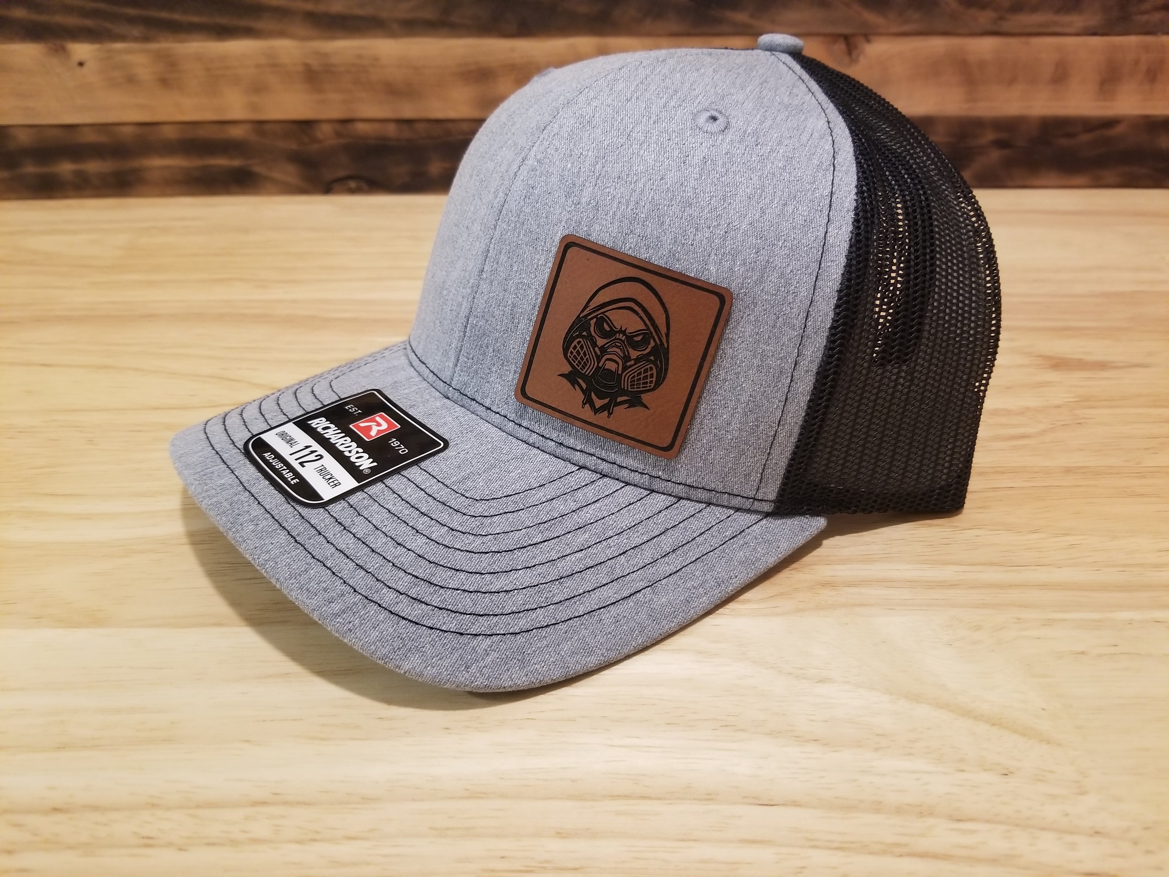 Body Shop Merch Hat with Rawhide Skull wearing paint mask and hoodie