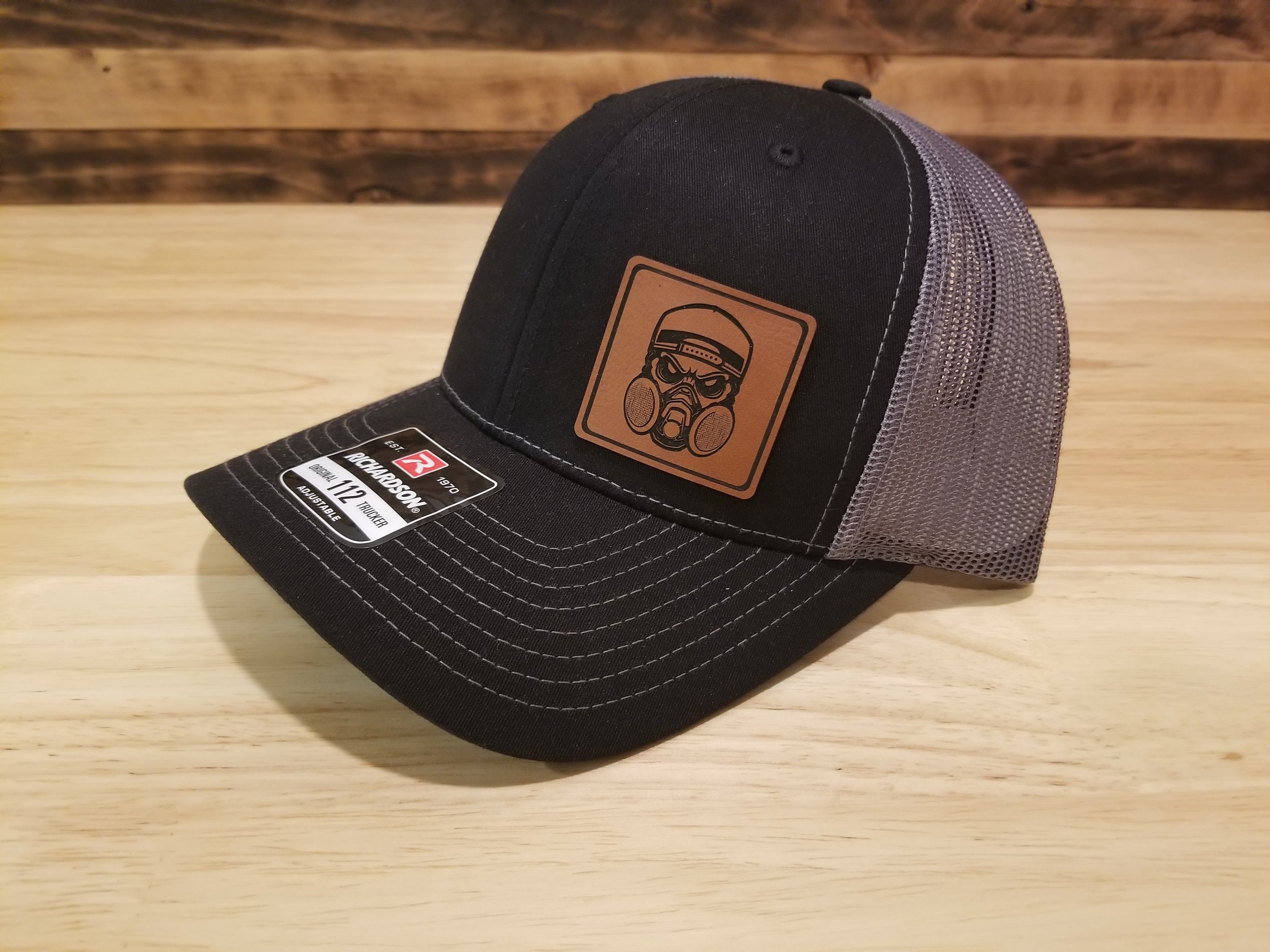 Body Shop Merch Hat with Rawhide Skull wearing dust mask and backwards cap