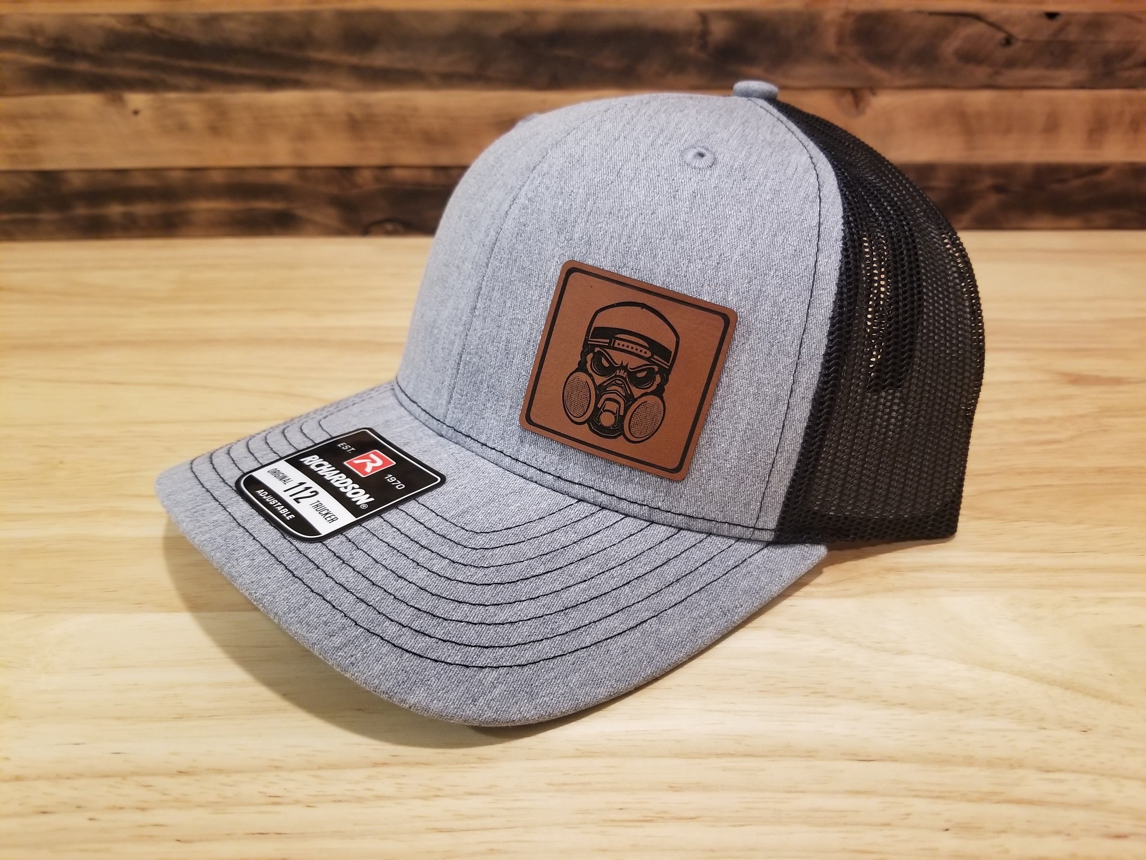 Body Shop Merch Hat with Rawhide Skull wearing dust mask and backwards cap