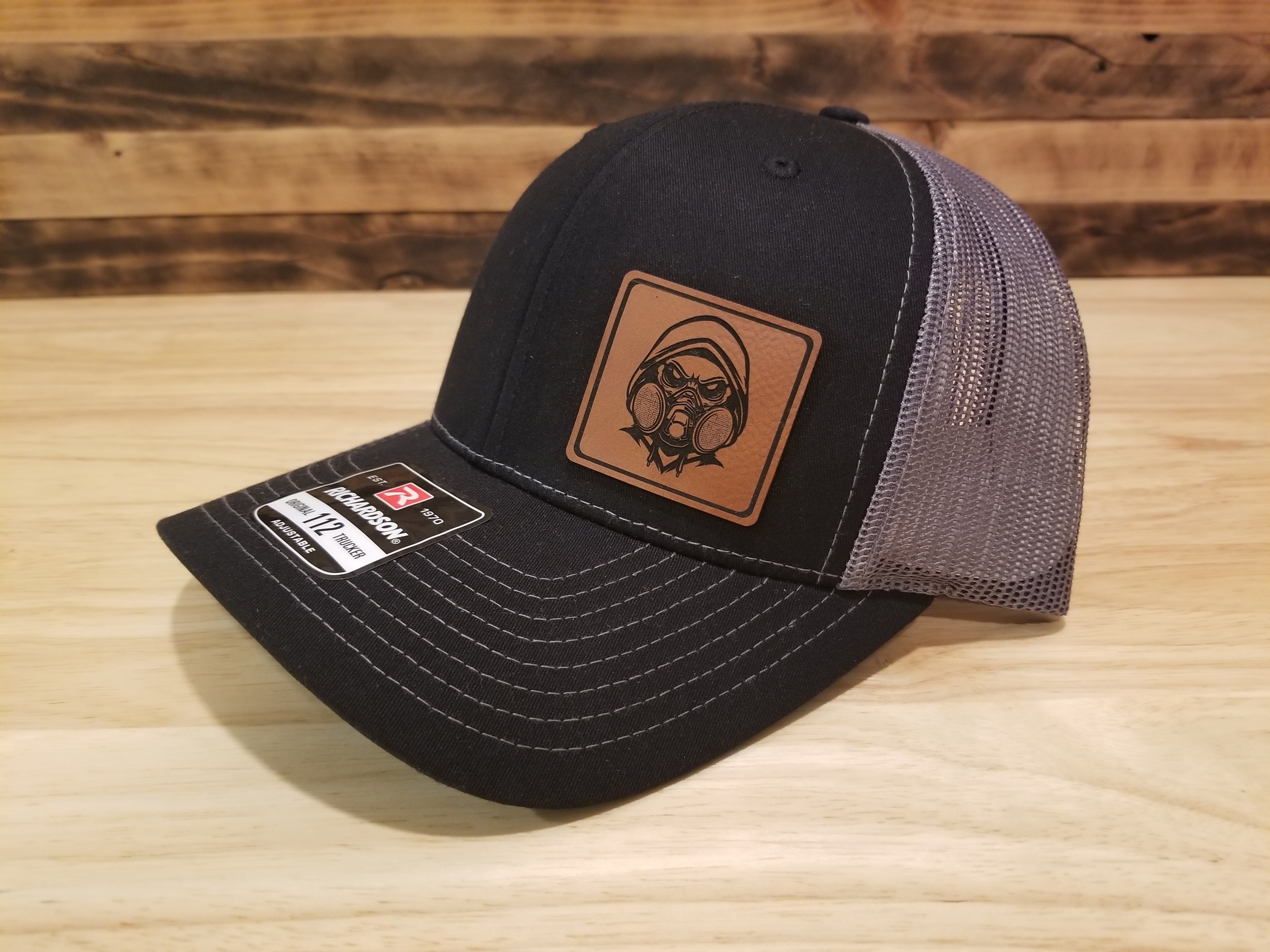 Body Shop Merch Hat with Rawhide Skull wearing dust mask and hoodie