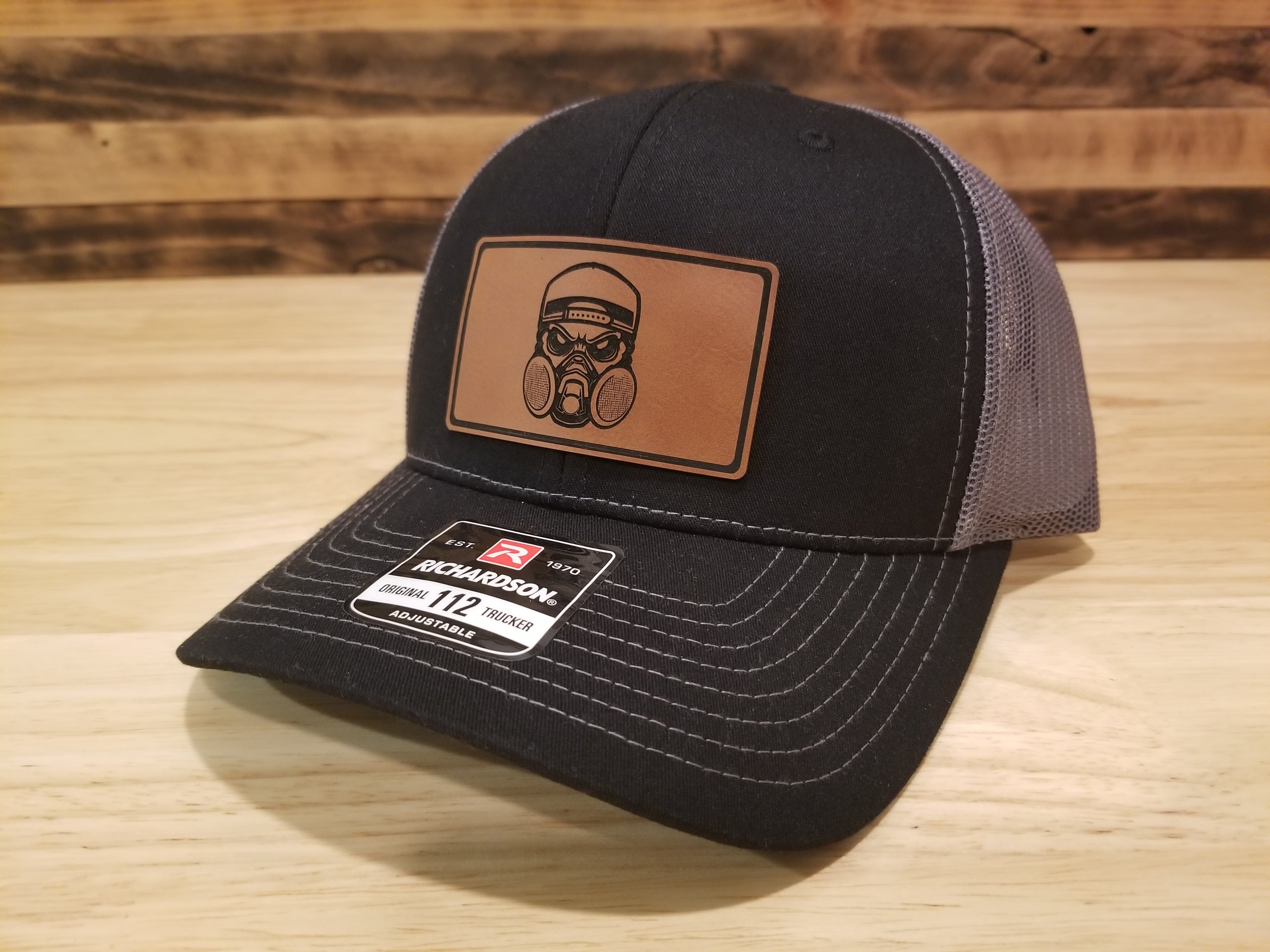 Body Shop Merch Hat with Rawhide Skull wearing dust mask and backwards cap