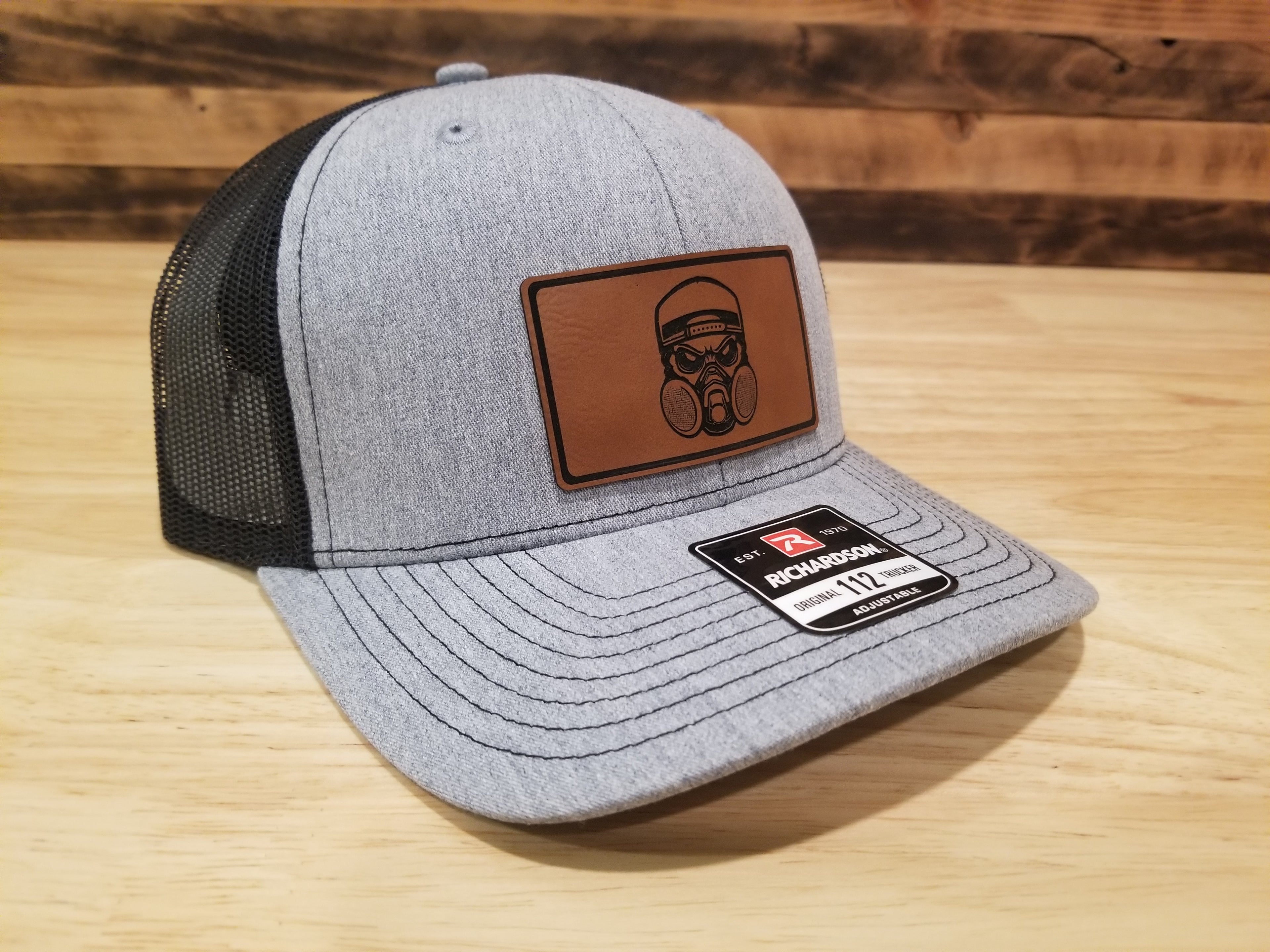 Body Shop Merch Hat with Rawhide Skull wearing dust mask and backwards cap