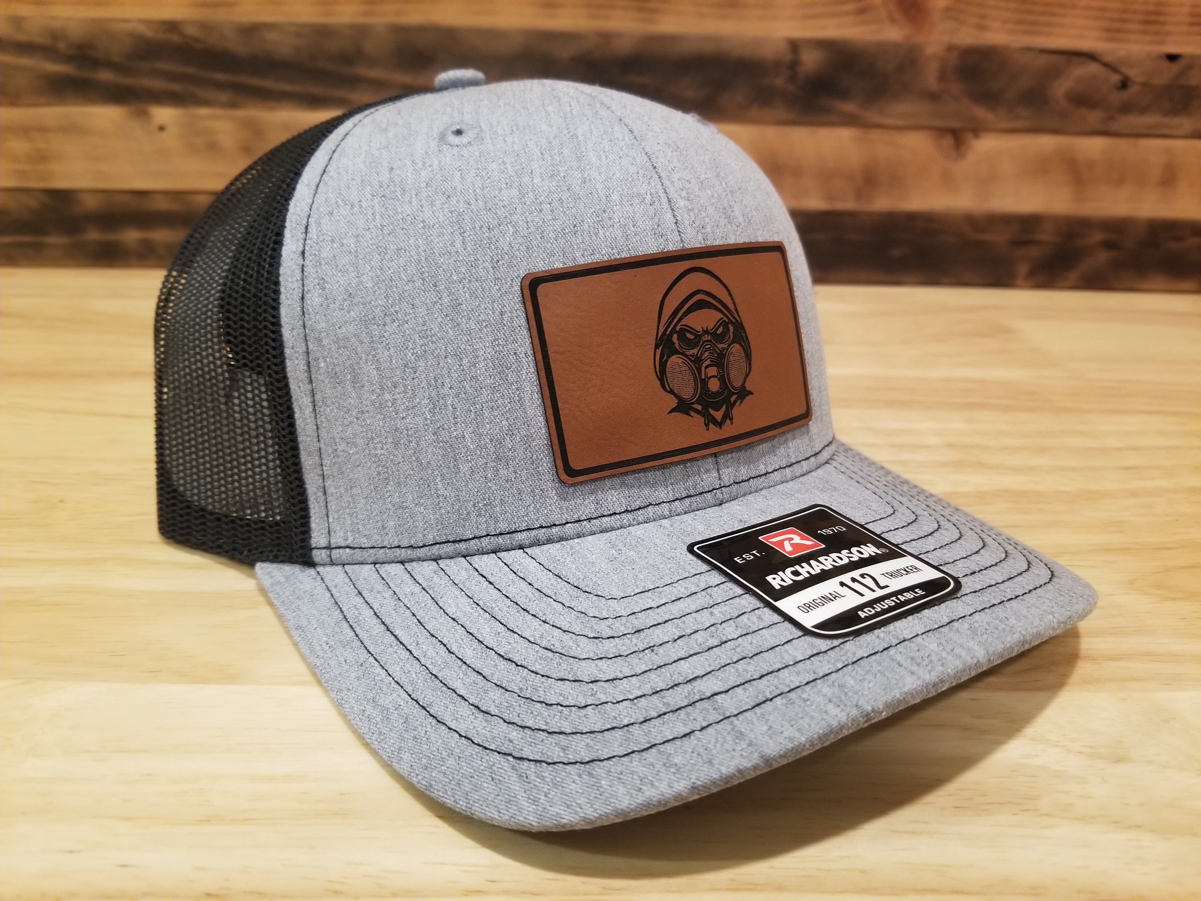 Body Shop Merch Hat with Rawhide Skull wearing dust mask and hoodie