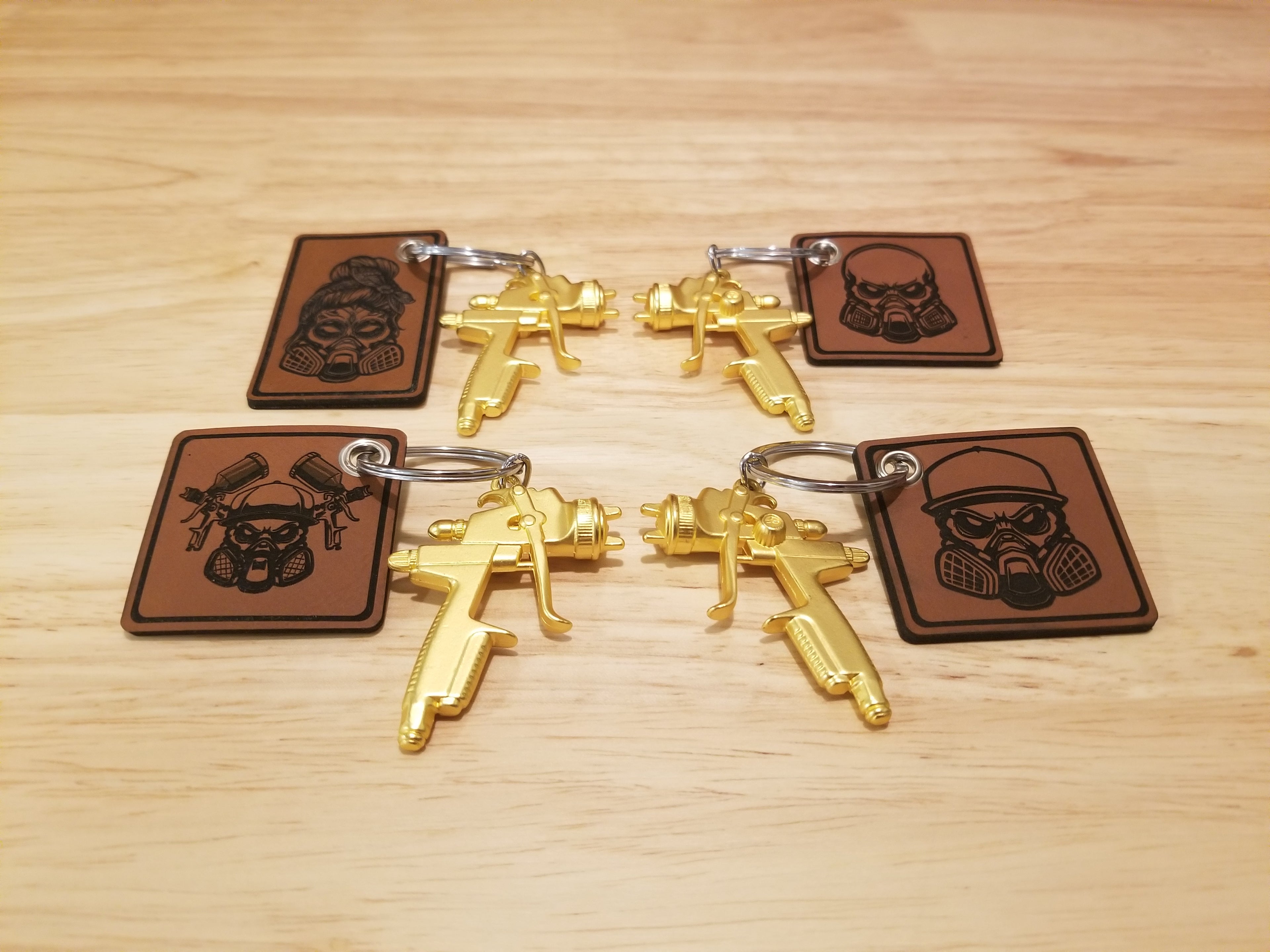 Body Shop Merch branded rawhide patch with Gold paint gun Keychain
