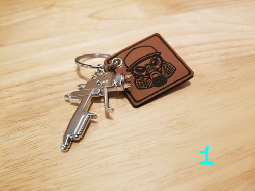 Body Shop Merch branded rawhide patch with Silver paint gun Keychain